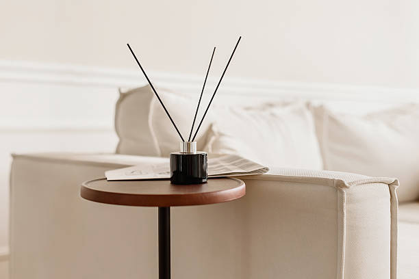 istock Stylish reed diffuser on wooden table in modern minimalist living room interior. 2248705943