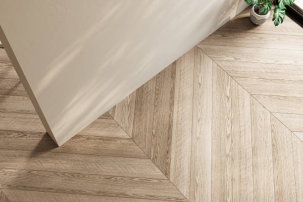 istock Top view of an empty interior with chevron wood flooring, soft lighting, and minimal decor. Ideal for backgrounds, mockups, or interior design presentations. 3D render. 2248706383
