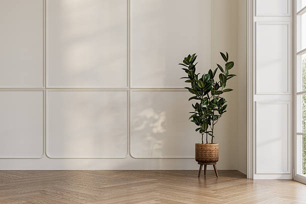 istock Minimalist interior with white panel wall, herringbone wooden floor, and potted plant in natural daylight. Perfect for mock-up or architectural visualization. 3D render. 2248706435