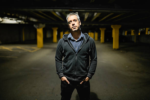 istock A portrait of a man inside basement at night 2248706873