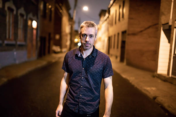 istock A Handsome man portrait in the city at night 2248707513
