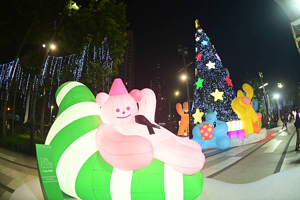 Bangkok , Thailand - November 26 , 2025 : Light , star and cartoon characters is decorate beautiful on Christmas Tree Celebration 2026 at Samyan Mithtown Department store for Christmas day and Happy New Year event in Bangkok on November 26 , 2025.