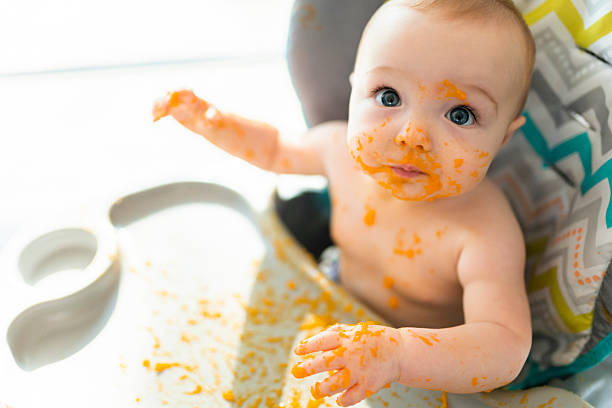 istock A happy little cute daughter with mash food everywhere 2248708201