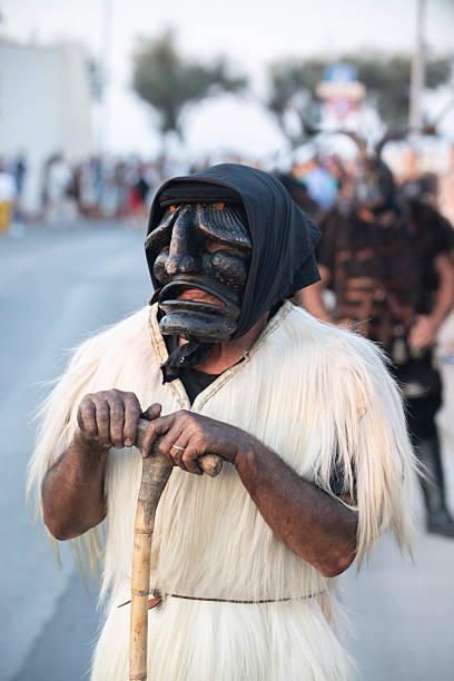 Italy, Sardinia, Porto Torres, August 24, 2025, traditional Sardinian costume masks. Su Maimoni de Tertenia e is Ingestusu