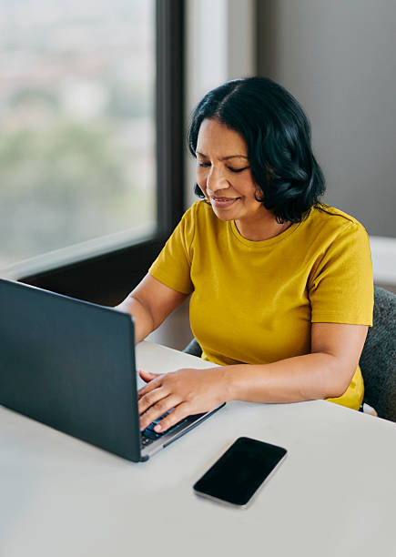 istock Mature Female Using Laptop At Desk 2248713216