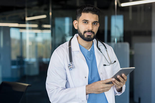 istock Indian doctor holding tablet working in modern hospital 2248714441