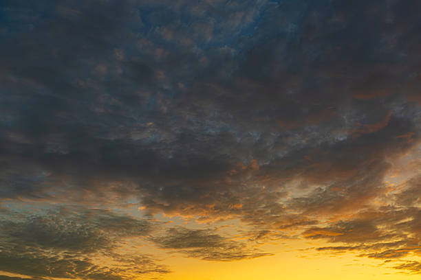 Twilight Clouds and Sky Backdrop,A beautiful sunset sky filled with soft pink, purple, and blue hues. The clouds are illuminated by the setting sun, creating a peaceful and serene atmosphere, ideal for backgrounds and designs.