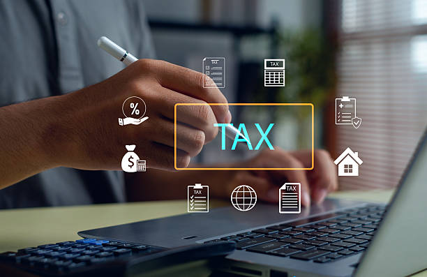 istock Businessman analyzing tax and finance data using a laptop with digital icons, symbolizing online taxation, accounting, financial planning, and digital economy management concept. 2248718046