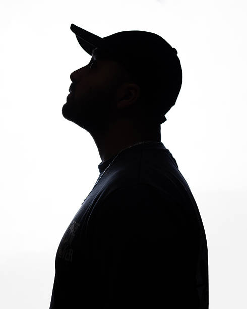 istock Silhouette of a young man looking up on a white background 2248719083