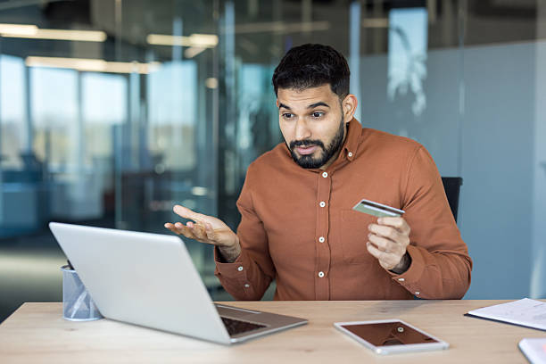 istock Man experiencing payment error during online shopping on laptop 2248719161