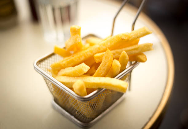 istock Paris, France: French Fries Wire Basket on Cafe Table Close-Up 2248721680