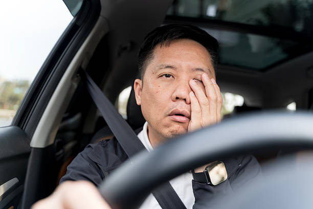 istock Exhausted driver rubbing his eyes while driving, showing fatigue, danger, and critical road safety awareness 2248722834