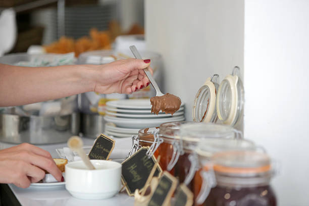 Woman taking food from a buffet line