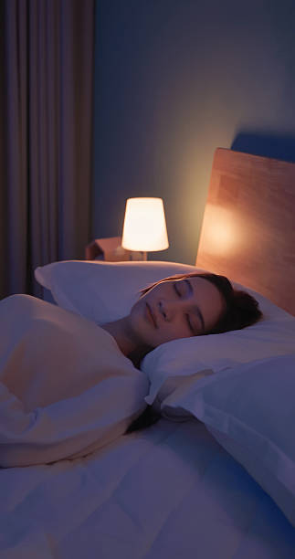 istock asian woman sleep at night 2248724718
