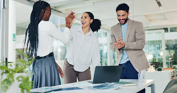 istock Business, laptop or team with high five celebration for investment return, KPI performance or success. Financial analyst, happy people or applause in office for risk mitigation or finance opportunity 2248725493