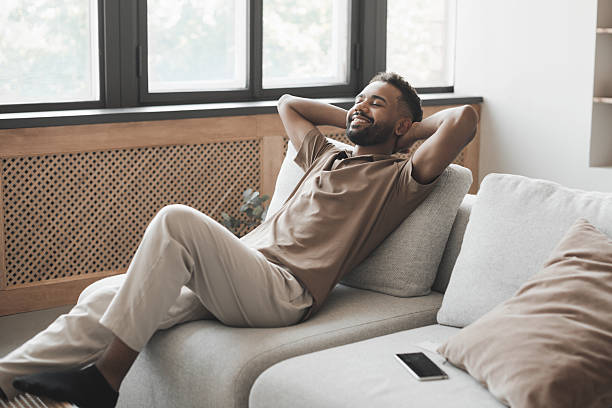 istock Relaxed young man relaxing at home 2248725604