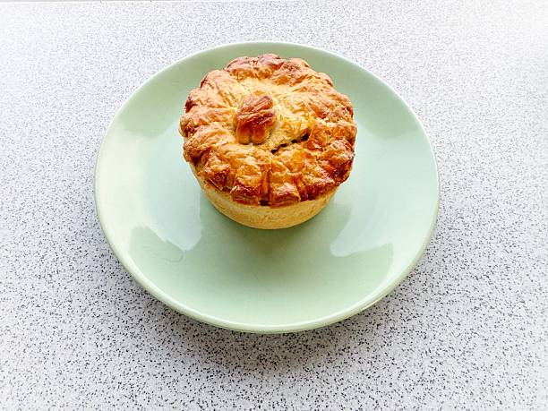 Freshly baked beef and red wine pie in shortcrust pastry
