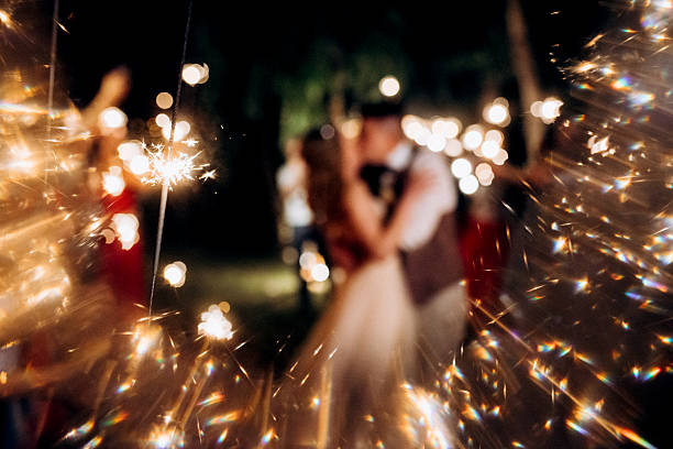 istock newlyweds at a wedding of sparklers 2248731264