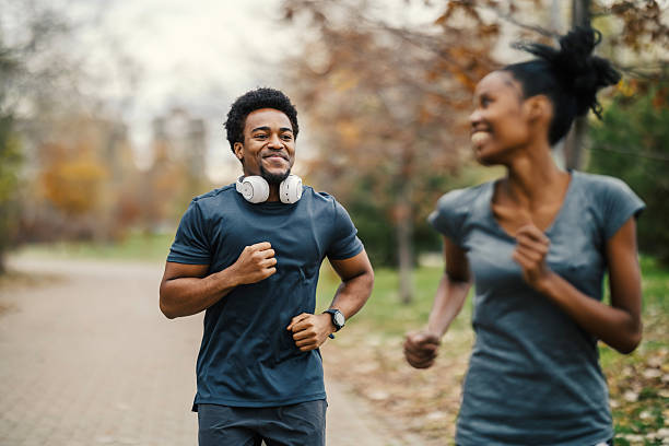istock Happy couple jogging in park for exercise 2248733303