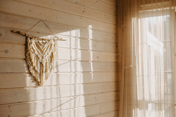 istock Macrame on the wall of a wooden house. 2248734199