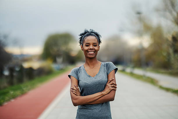 istock Confident young woman smiling on running track 2248736623