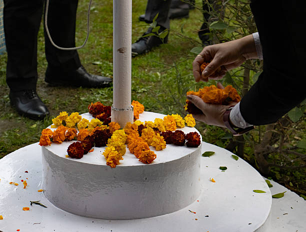 istock hands placing flowers on a white platform for India Day 2248737130