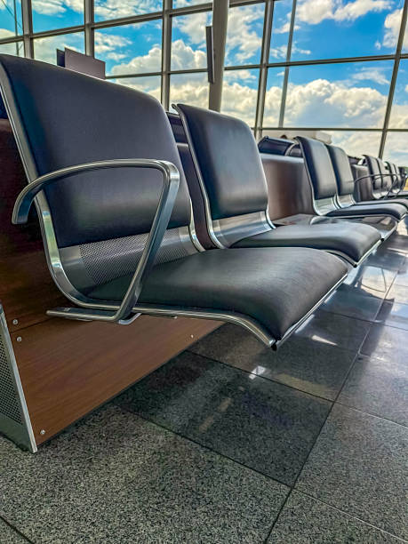 istock Empty airport waiting area with modern chairs and glass windows 2248737262