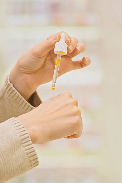 istock Woman testing serum texture on her hand before purchase in a beauty store 2248739361