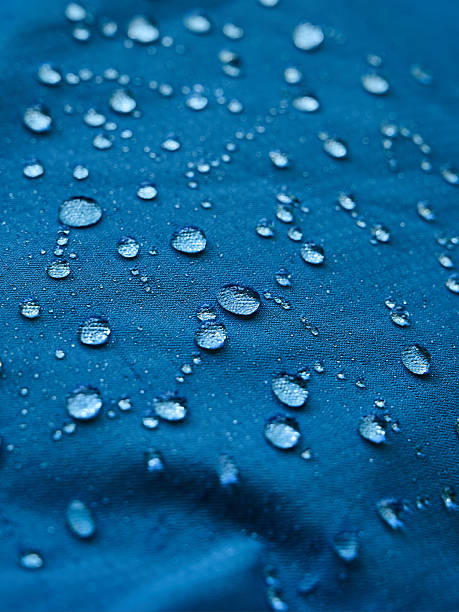 istock Water droplets on blue fiber waterproof fabric. Blue background. 2248739432