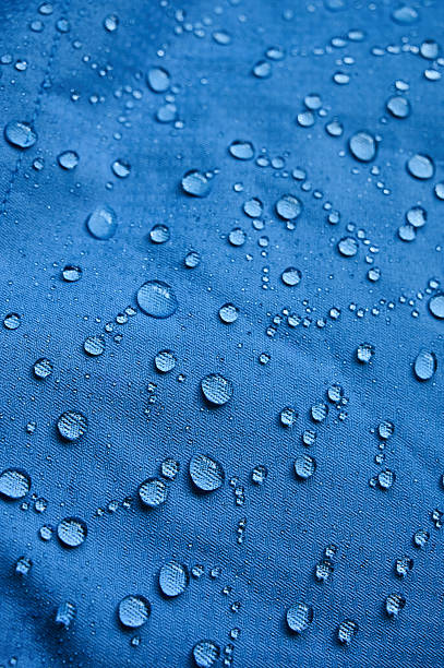istock Water droplets on blue fiber waterproof fabric. Blue background. 2248739440