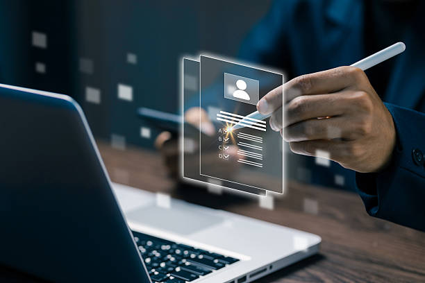 istock A digital resume interface floating above a laptop as a person interacts with it, representing online recruitment, HR technology, candidate evaluation, and modern hiring processes. 2248739768