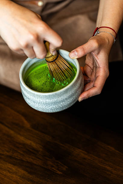 istock Preparing traditional matcha tea in a ceramic bowl 2248740351