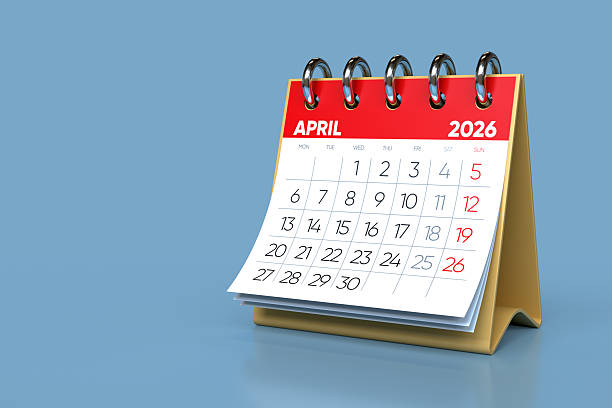 istock Desktop Calendar Showing April 2026 on Blue Background 2248740424