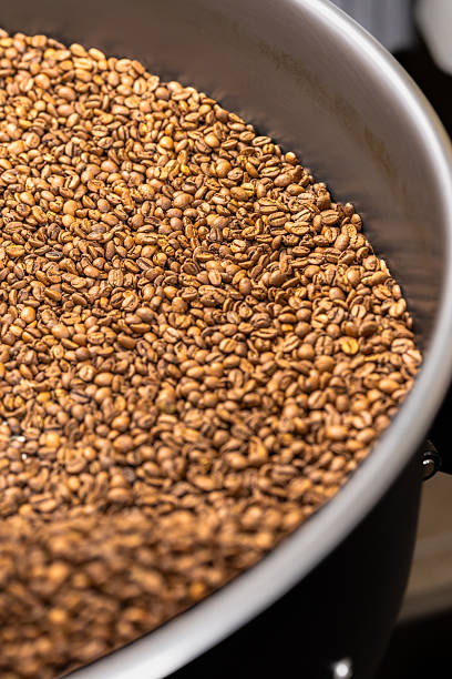 istock Freshly roasted coffee beans in a metal roasting drum 2248740749