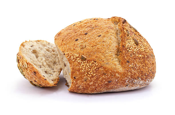 istock One loaf and a piece of bread with seeds. 2248741925