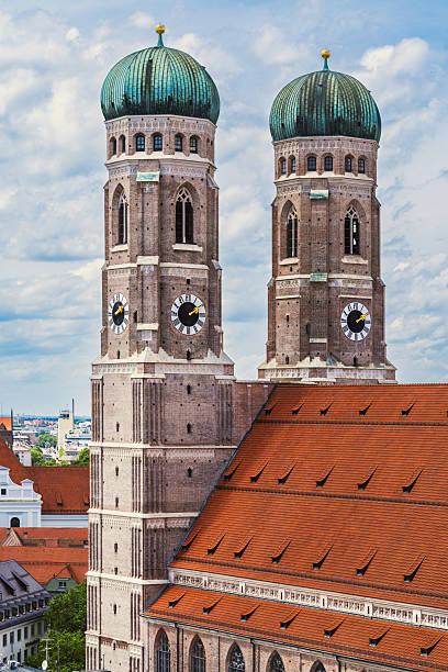 istock Twin Bavarian Clock Towers Over Red Rooftops 2248742089
