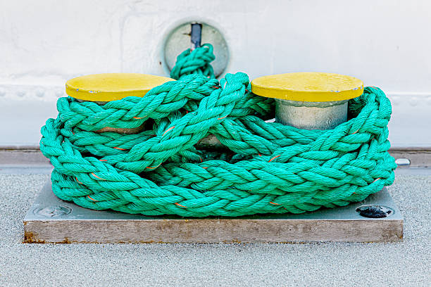 istock Bollard at the harbor with green rope 2248742288