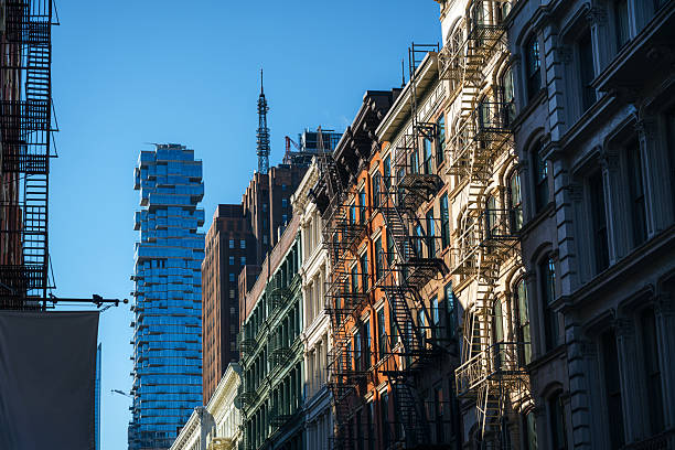istock City Street With Fire Escapes And Modern Tower 2248742901