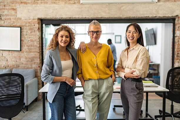 istock Diverse businesswomen team standing smiling in modern office 2248743106