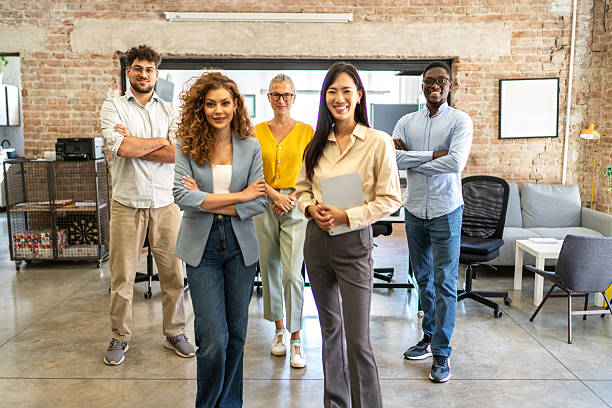 istock Diverse business team standing together in modern office 2248744980