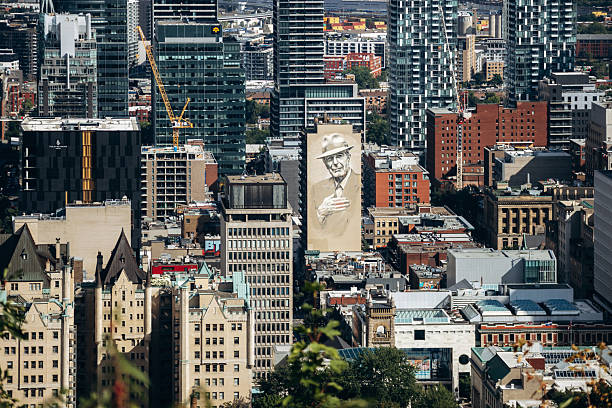 Montreal, Canada - August 15, 2025: Large mural on a building facade seen from Kondiaronk Belvedere
