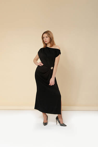 istock Female model studio portrait wearing black maxi dress with  beautifully draped front for a touch of sophistication and flow— elegant minimalist fashion collection 2248749596