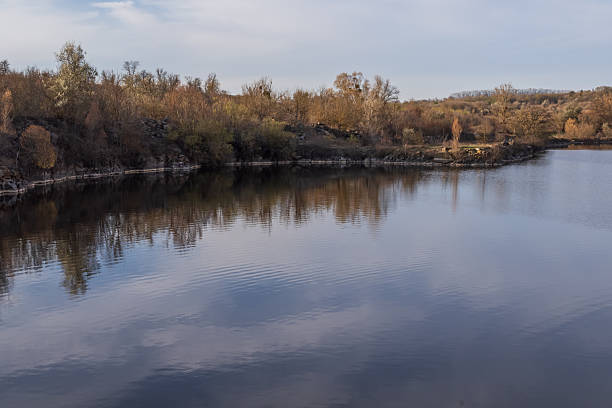 istock Abandoned Granite Quarry Lake with Reflective Water 2248761165