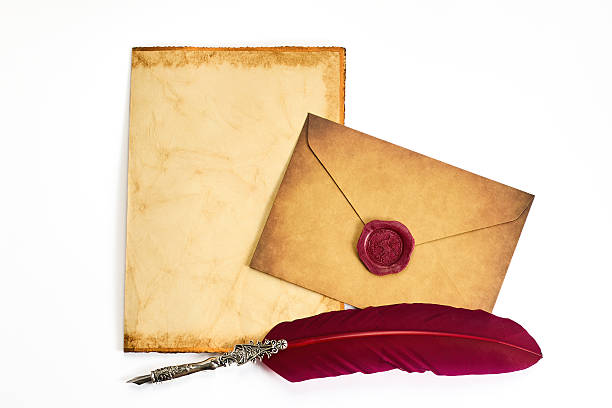 istock Vintage Letter Set. A parchment, sealed envelope, and quill evoke an old-world charm. 2248761472