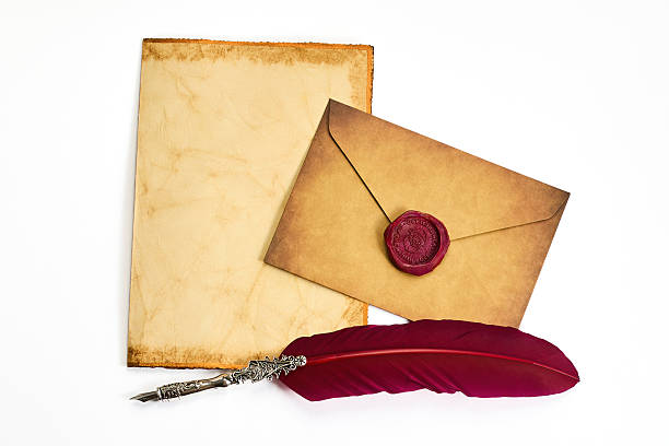 istock Vintage Letter Set. A parchment, sealed envelope, and quill evoke an old-world charm. 2248761478