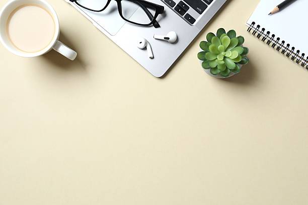 istock Office table with laptop, notebook, coffee cup and glasses, top view 2248762961