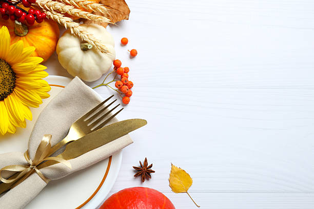 istock Festive table setup. Top view with plates, cutlery and autumn decorations. Thanksgiving or Harvest Festival. Empty space for your text 2248763412