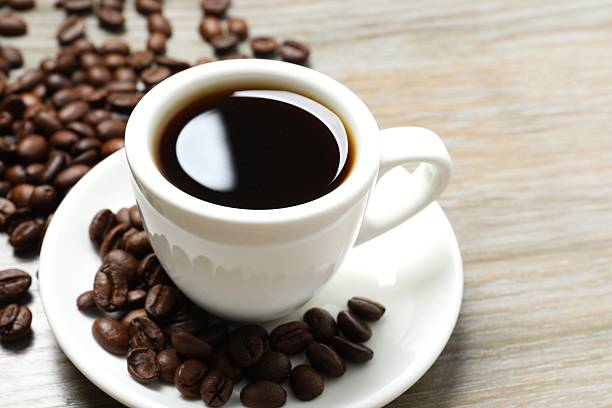 istock Cup of coffee on wooden table 2248765537
