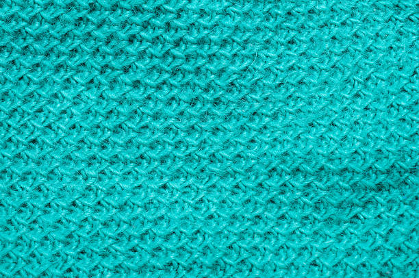 istock Close-up of a teal knitted fabric with a textured pattern for backgrounds 2248765929