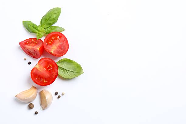 istock Composition with red cherry tomatoes, paper and basil on white background 2248765944